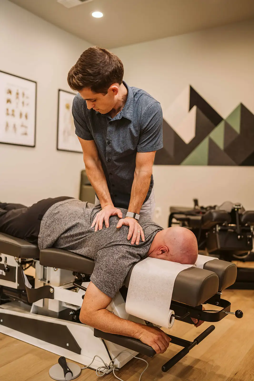 Dr. Hiebert providing hands-on chiropractic care to a patient on a treatment table