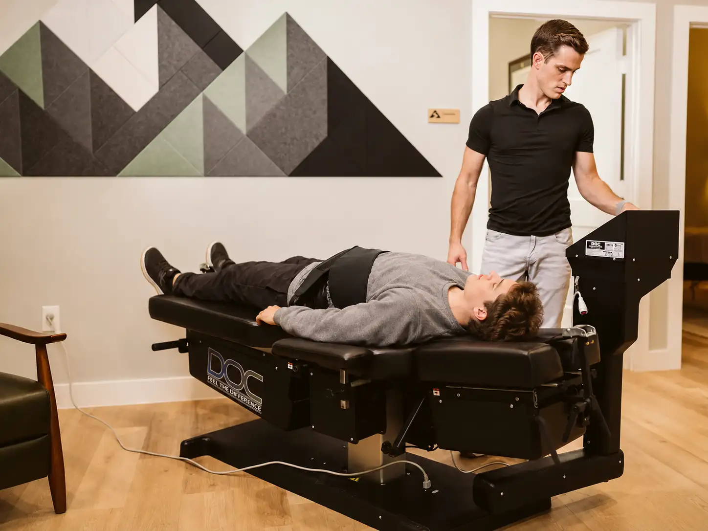Patient receiving spinal decompression in the Summit treatment room