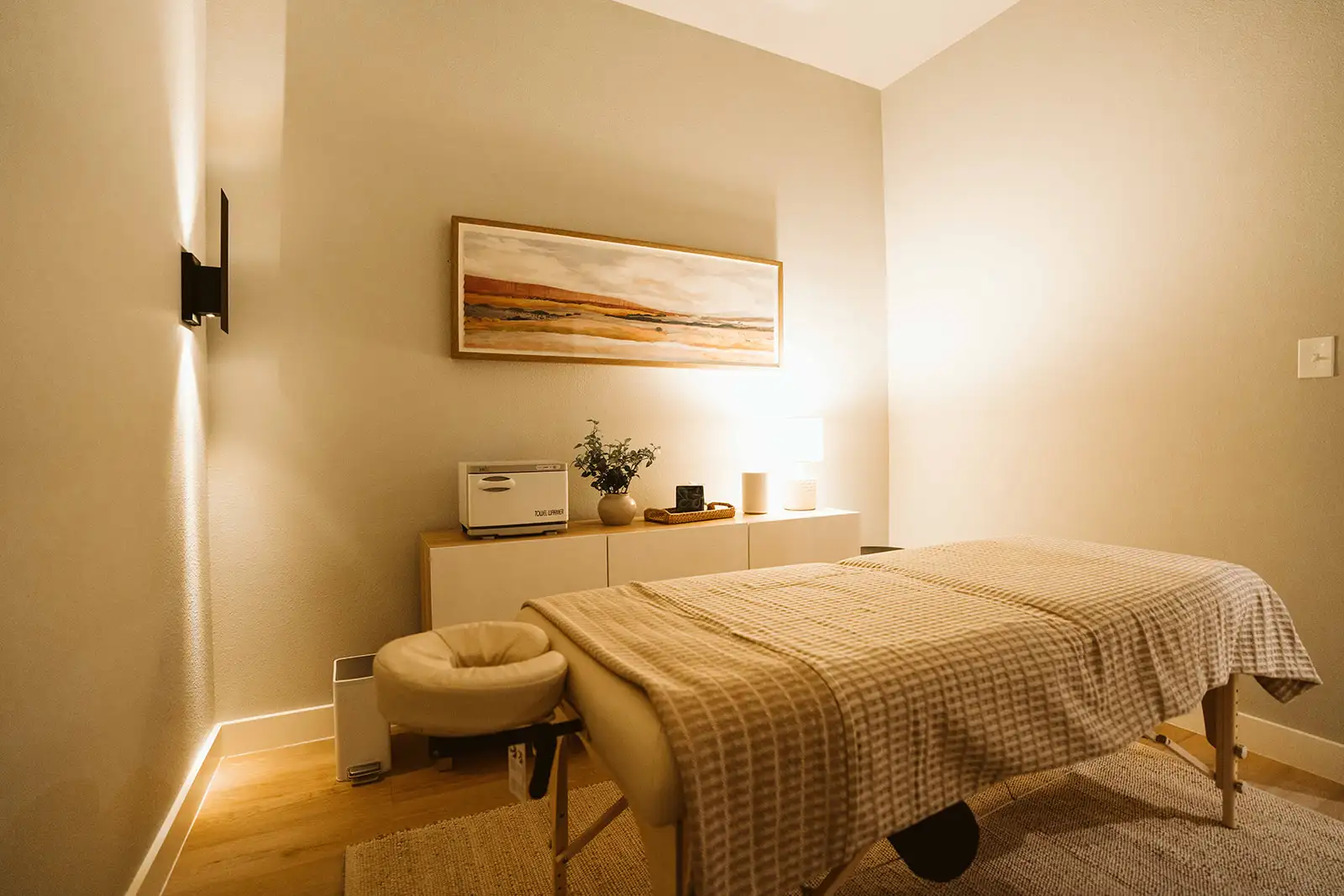 Massage table in Summit’s warmly lit treatment room